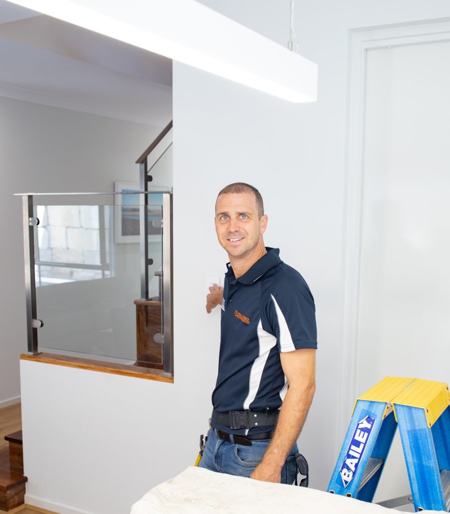 Fully Wired licensed electrician in uniform ready to attend an urgent electrical fault in Brisbane
