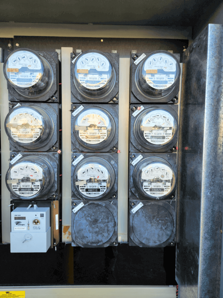 Older electricity meters and wiring awaiting inspection by an electrician