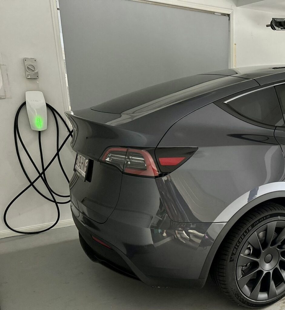 Home EV charger installed by Fully Wired in a Chapel Hill garage with an electric car charging