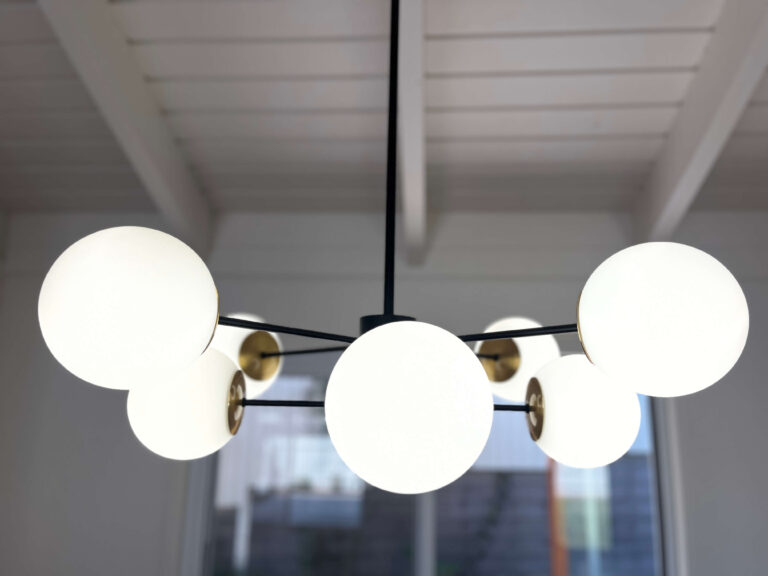 Modern globe feature pendant light installed during a Kenmore home renovation
