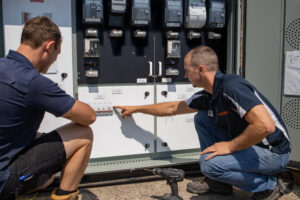 Electricians checking a switchboard